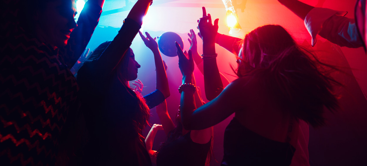 A group of people dancing at a party