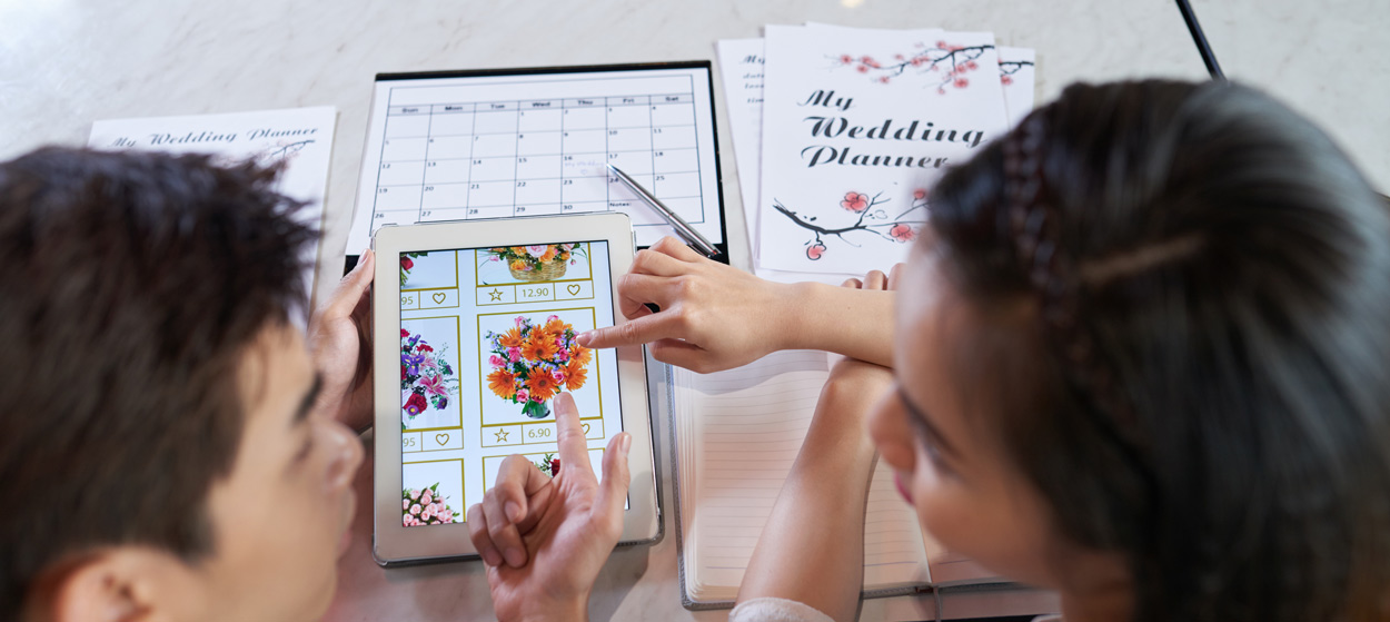 A couple discussing flower options for their wedding