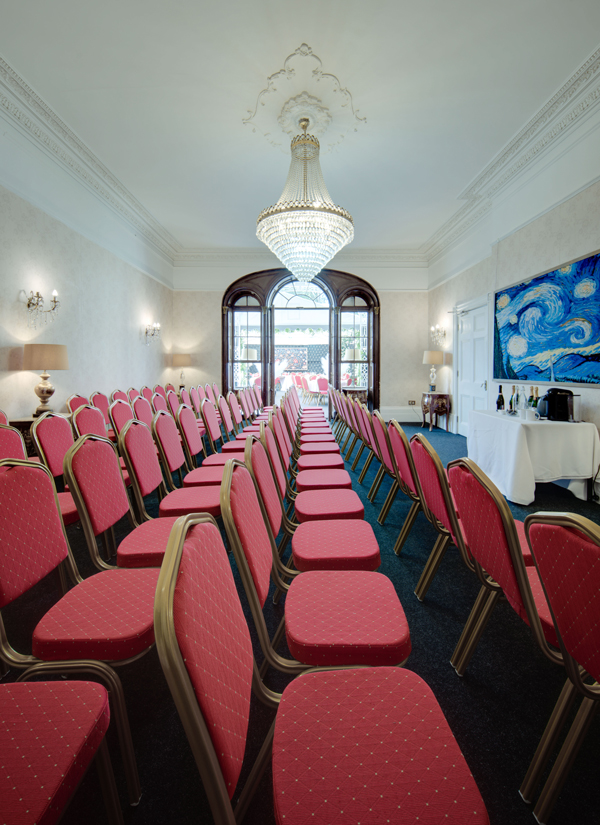 A meeting room at stone court house set up with chairs