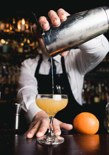 a barman making a cocktail