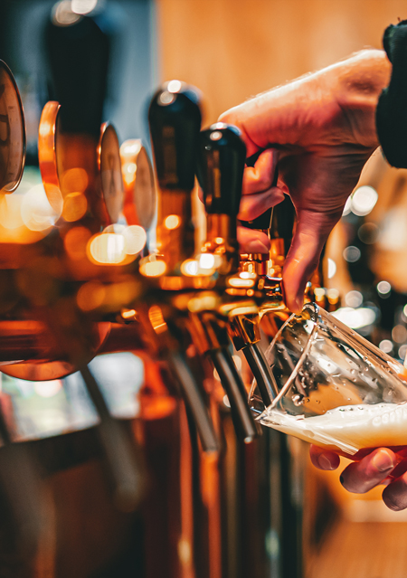 a barman pouring a beer