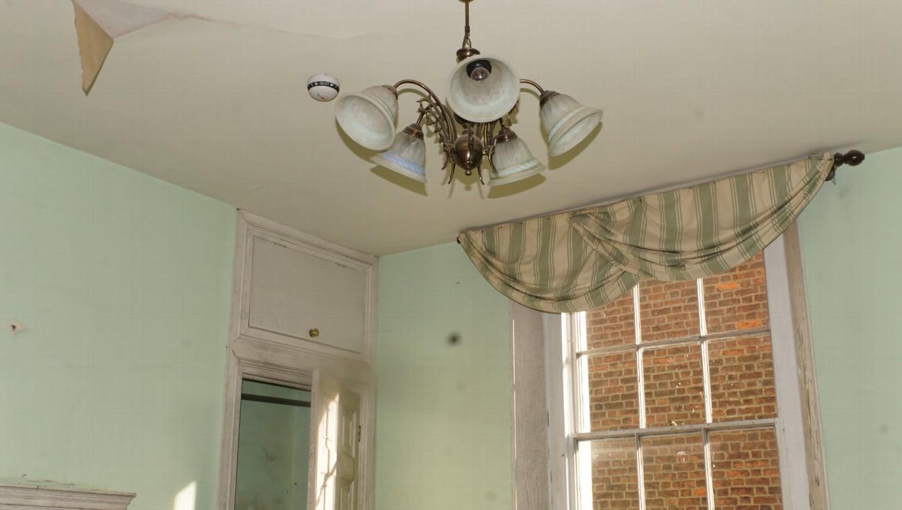 The Judge Alverstone room before restoration, showing the ceiling and window