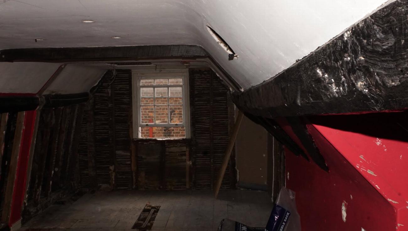 The sloping roofline of the Judge Rigby room before restoration