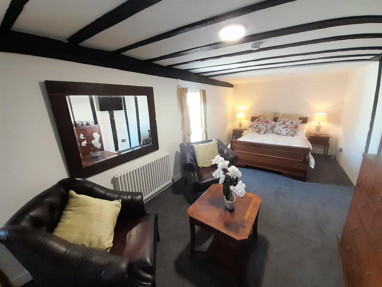 The finished Judge Scrutton Servants' Quarters with its bed and beams