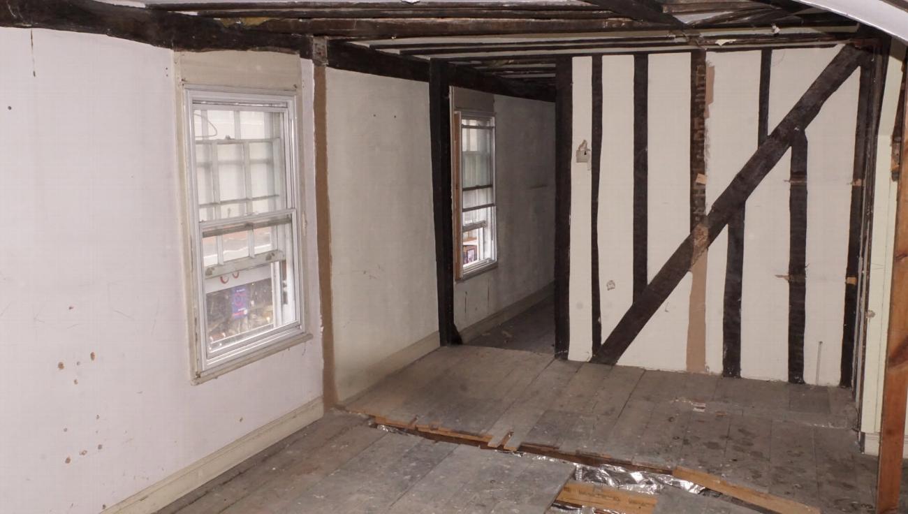 The servants' quarters at Stone Court House before restoration, stripped to the timber frame