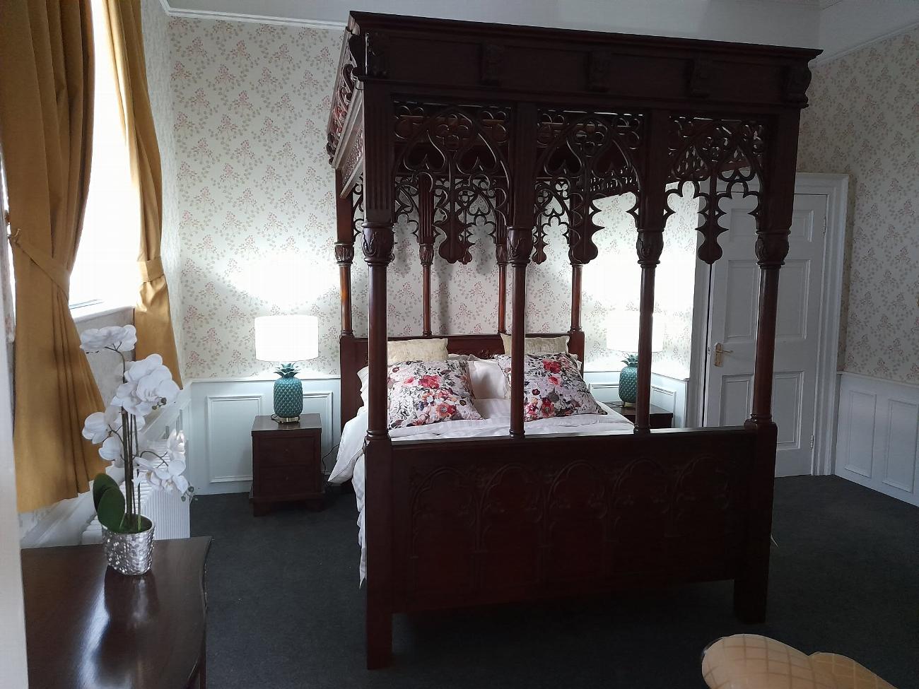 The restored bridal suite bedroom at Stone Court House