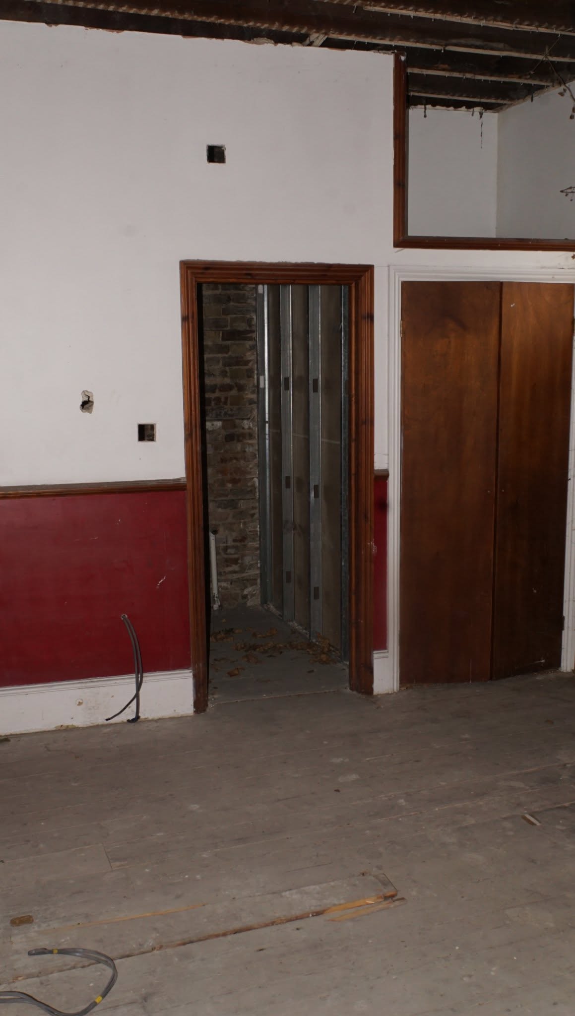 A bridal suite window and cornice before restoration