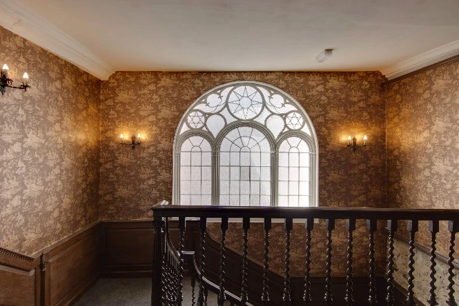 The restored landing and window above the staircase at Stone Court House