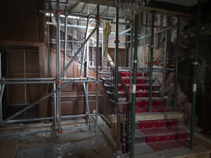 The staircase at Stone Court House under scaffolding during restoration