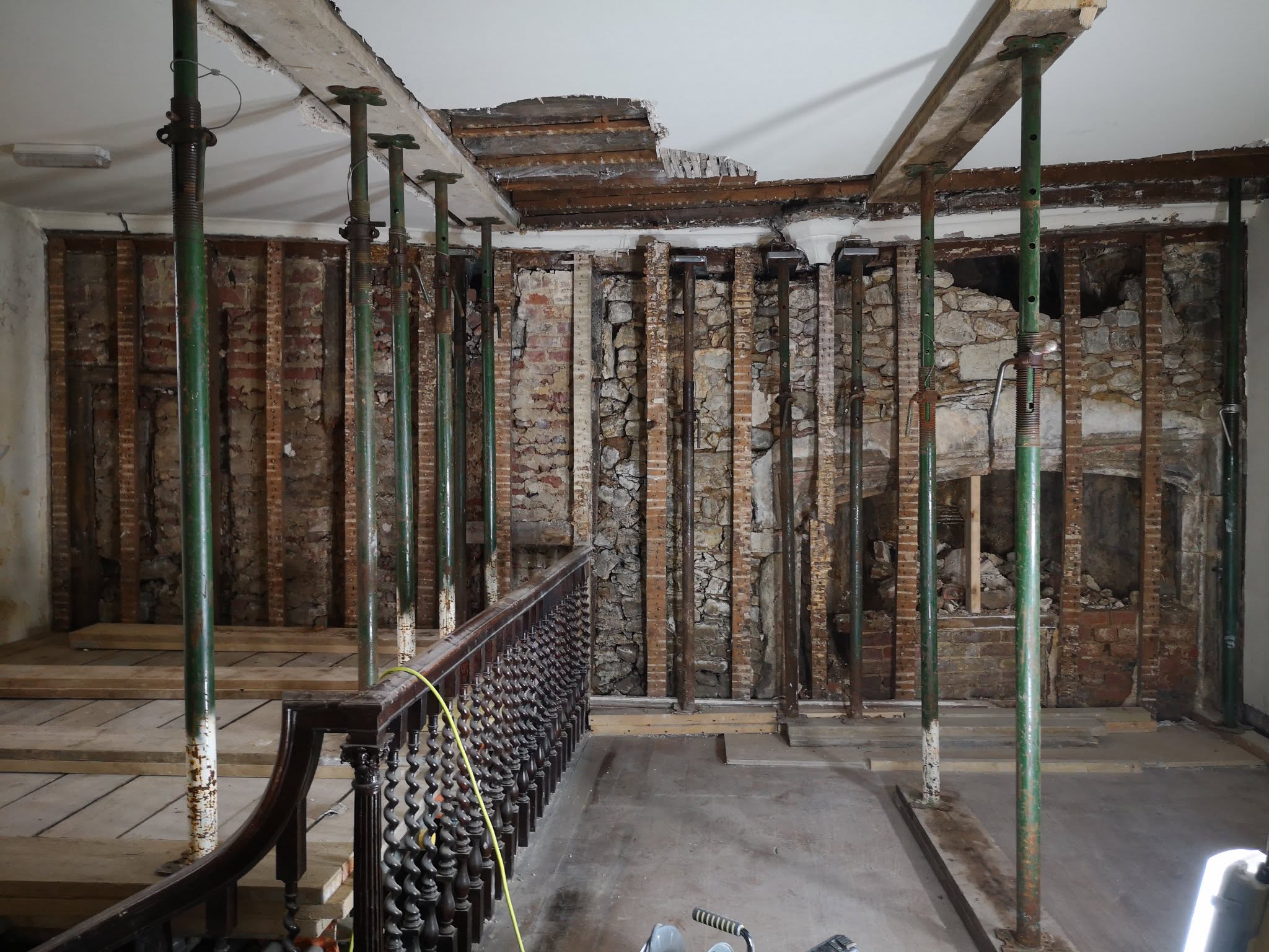 The medieval wall at Stone Court House propped and exposed during restoration