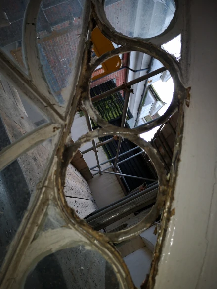 Staircase window at Stone Court House before restoration