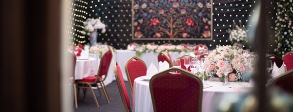A marquee with fairy lights and tables